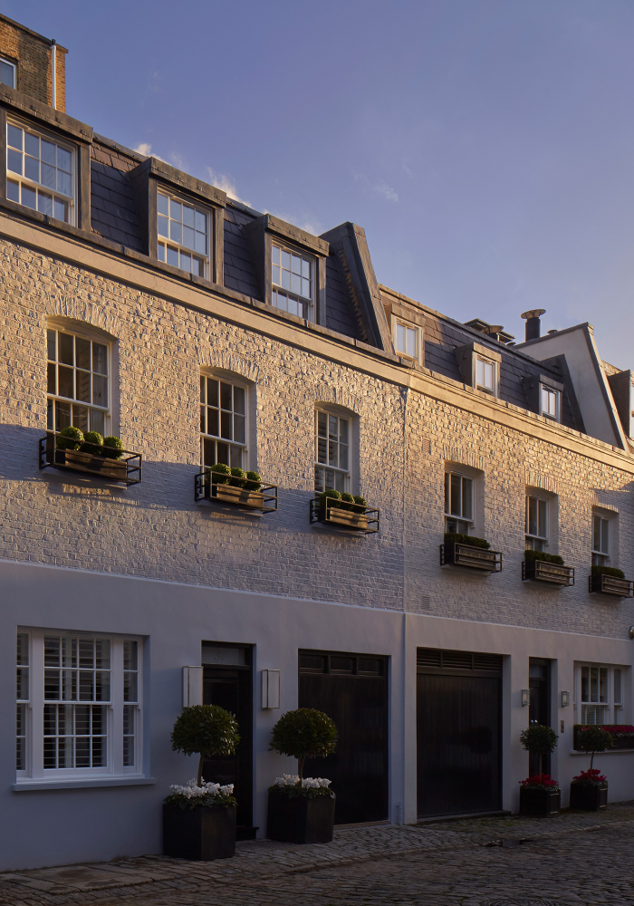 Shows a side view of the exterior of the recently renovated Mews House