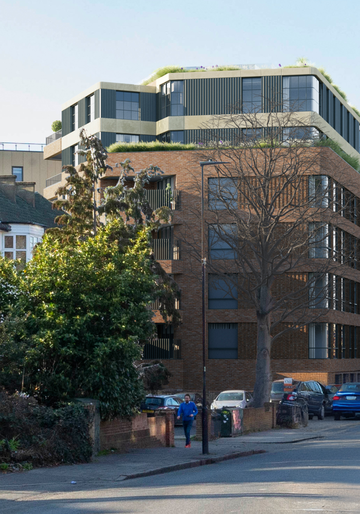 Shows a side facing view of the street and the recently renovated mixed use building in Lambeth
