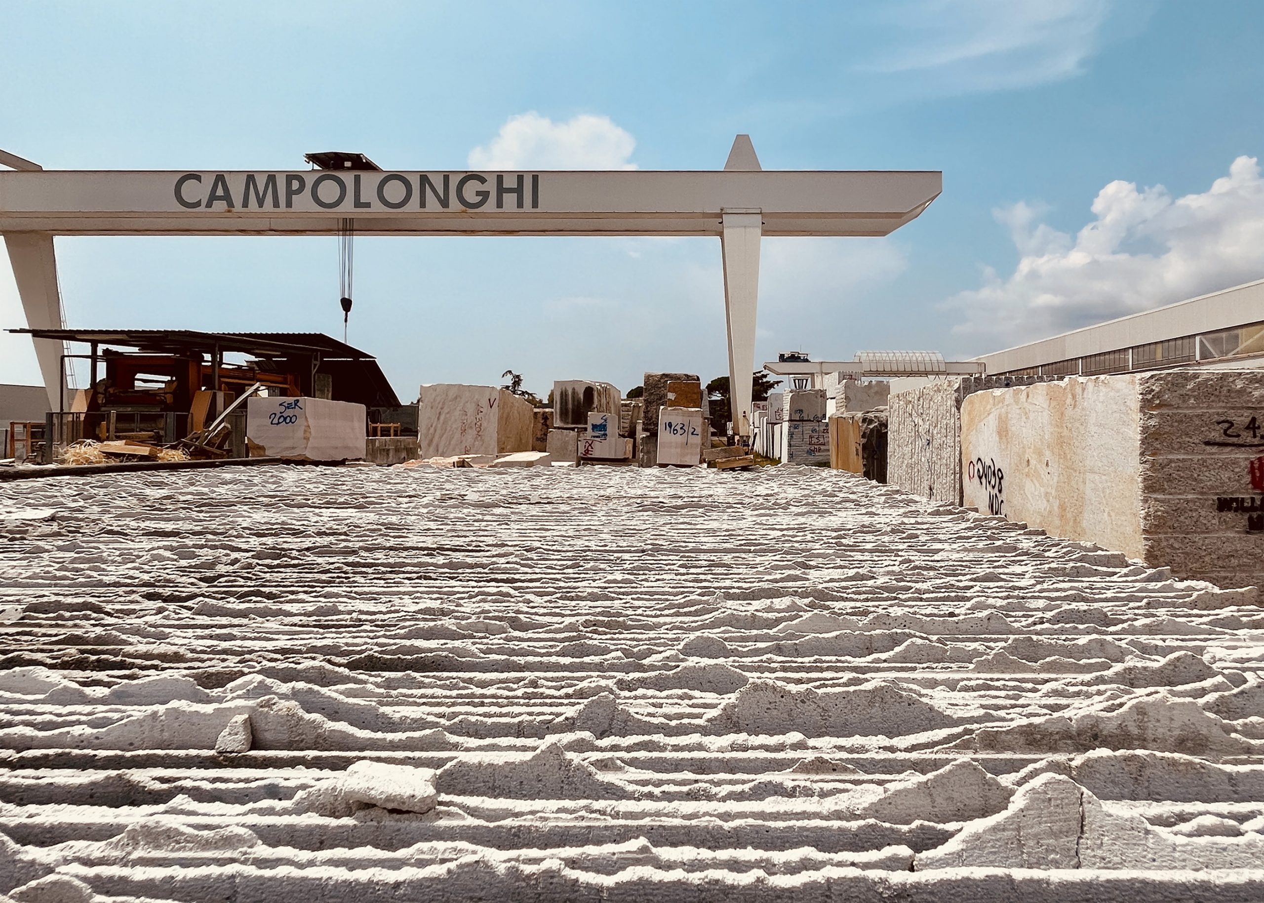 Shows the exterior of Campolonghi stone suppliers in Italy - Couture House Chelsea Architectural Project